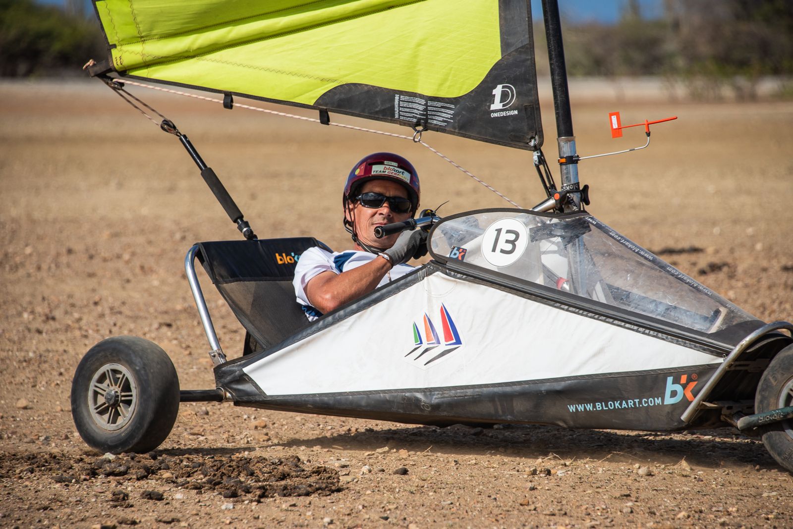 A sailor grinning mid-race